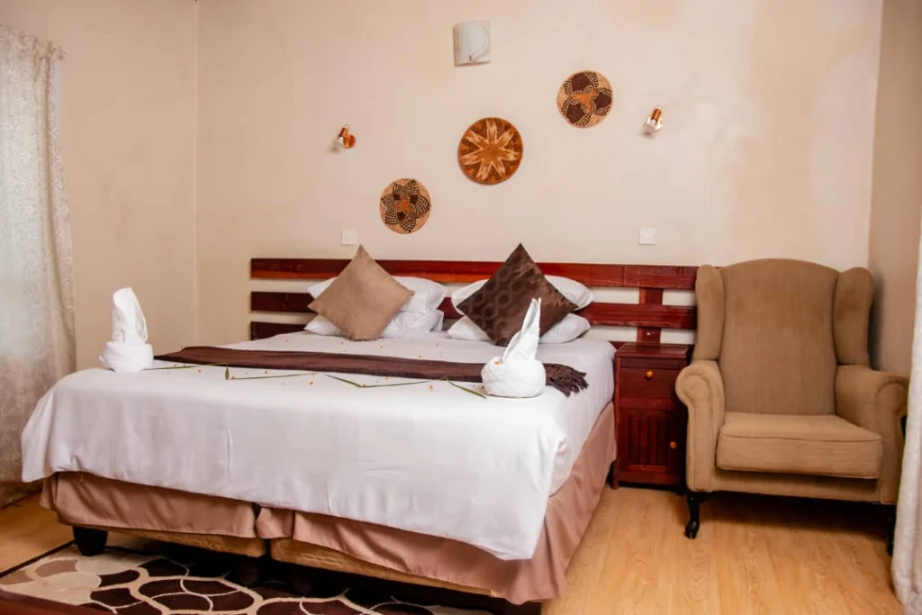 “Two-person traditional chalet entrance framed by plants and garden path.”